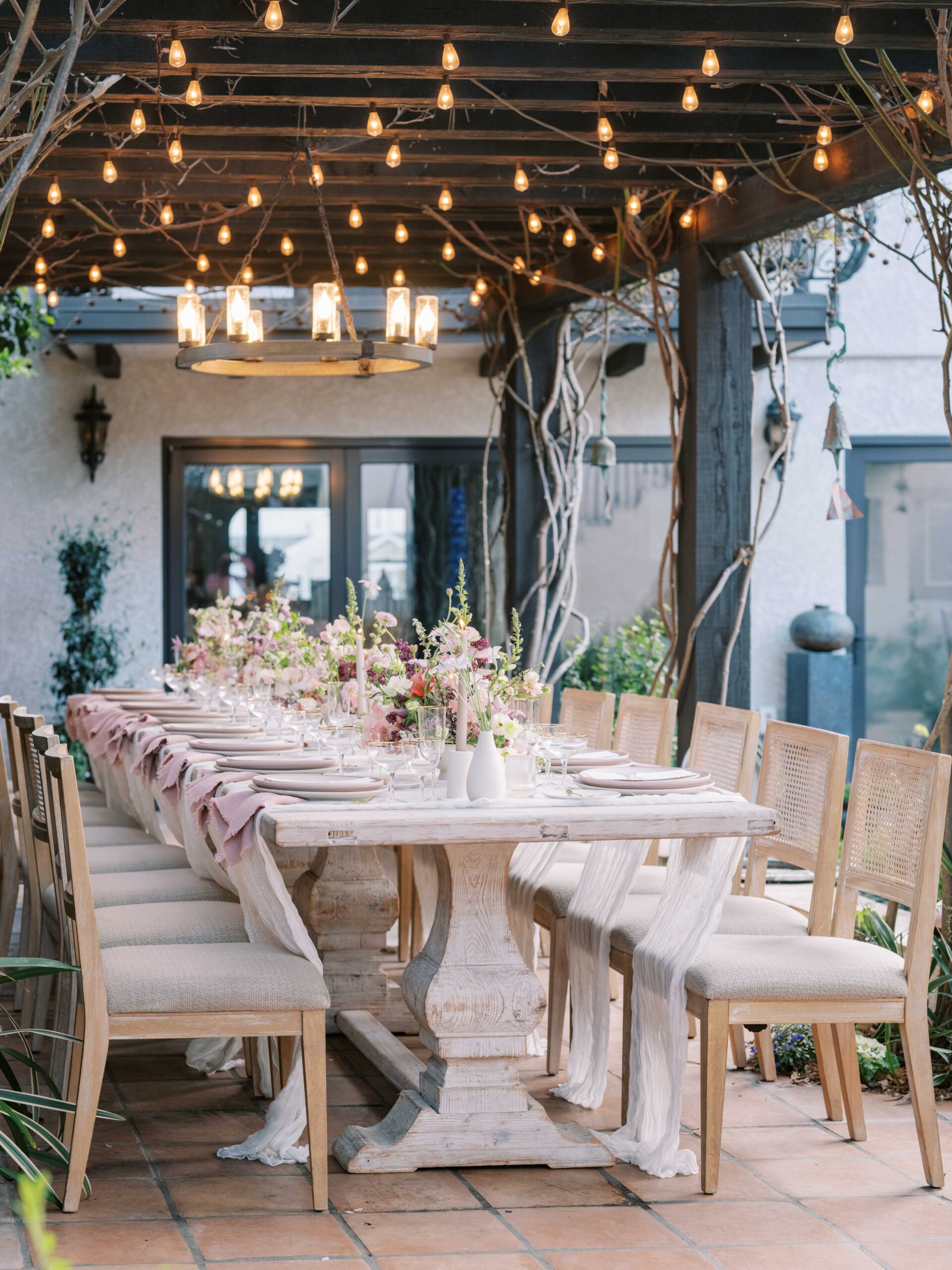 This whimsical, pink and purple wedding in La Jolla under the twinkle lights was inspired by Bridgerton and set in a beautiful intimate garden.