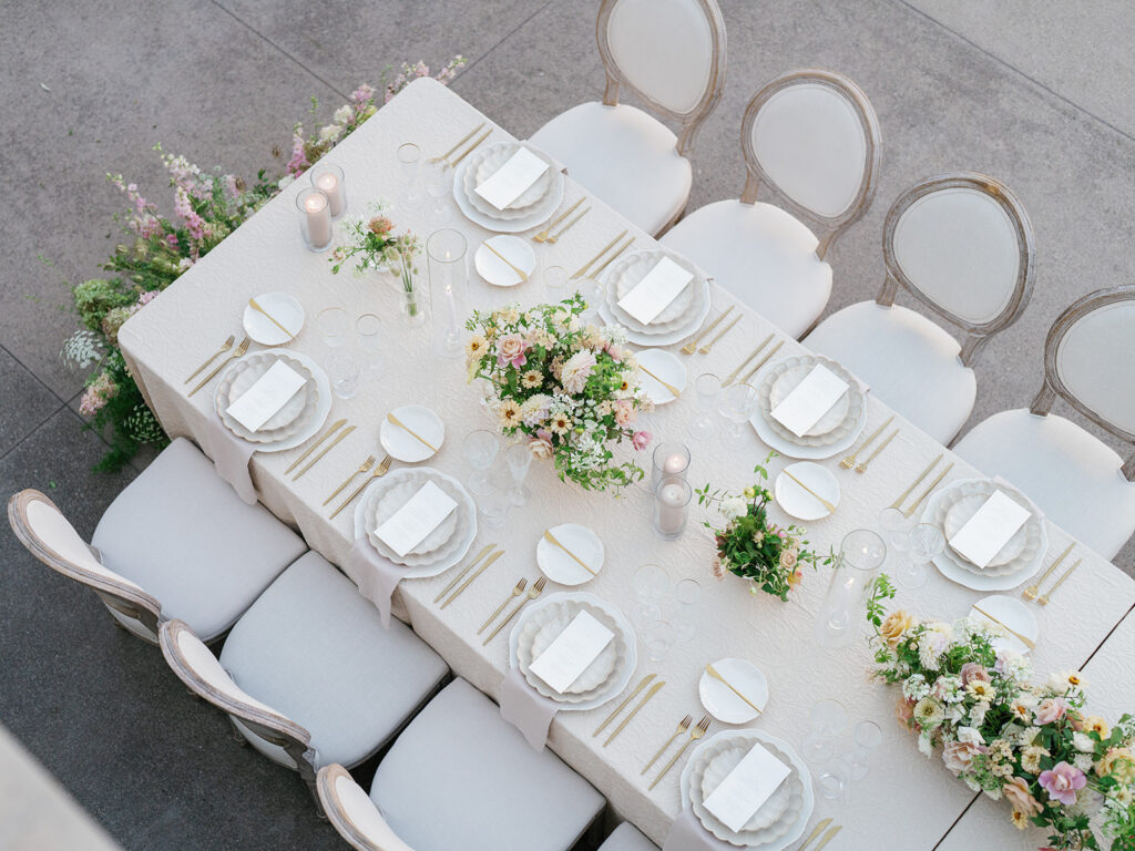 Neutral and light pink toned wedding reception decor with European influence at one of San Diego's best venues Monserate Winery, designed by wedding planner Bryce Gaston Events. 